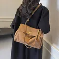 Vintage brown frosted leather shoulder bag for women with metallic twist-lock closure - Large (37x12x22) / Brown