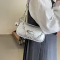Metallic silver pleated shoulder bag with chunky chain and sphere pendant detail - Silver