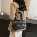 Elegant vintage black leather handbag for women featuring gold hardware and a long strap - 27*12*17 / Black