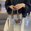 Grey textured bucket bag with brown leather trim and a cute puppy charm accessory - Basic Style / Brown and Blue