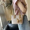 Chic beige bucket bag with ice-crack texture and cute dog charm for stylish women - With Charm Style / Khaki