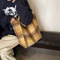 Large yellow plaid wool tote bag for autumn and winter being carried in a home setting - Style 1 Yellow Plaid (Handmade Metal Tag)