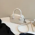 Mini borsa bianca chic con trama coccodrillo e attacchi per manici a forma di cuore - Bianco