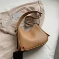 Minimalist brown leather hobo bag with adjustable wide shoulder strap and gold buckle - Khaki