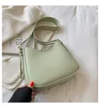 Minimalist mint green leather shoulder bag with tassels and gold metallic buckle - Green