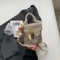 Beige and brown leather bucket bag with silk scarf handle and plush pendant - White With Pendant