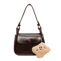 Retro dark brown crossbody bag with large round button and cute plush charm detail - Coffee