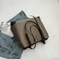 Minimalist khaki nylon tote bag with brown leather trim and dual shoulder straps - Patchwork Coffee