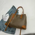 Minimalist khaki nylon tote bag with brown leather accents and large capacity - Color-block Brown