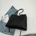 Minimalist black large capacity tote bag in sleek PU leather for daily commuting - Black