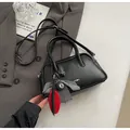 Close-up of black retro bowling bag with Far K logo, heart print and trendy charms - With Pendant / Black