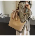 Khaki pebbled leather tote bag with a checkered silk scarf on the handle - Khaki