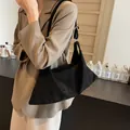 Large black plush tote bag with geometric design and silver ring crossbody strap - Black