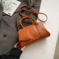 Chic orange faux leather square bag with dual handles and crossbody strap detail - 24*8*13cm / Caramel color