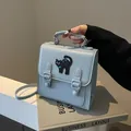 Light blue square handbag with cute black cat embroidery and adjustable shoulder strap - 20x8x20cm / Blue