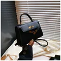 Classic black leather-textured handbag with gold hardware and top handle strap - Black / 19.5cm x 14cm x 8cm