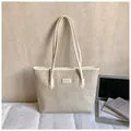 Minimalist cream tote bag with embossed heart pattern and logo for daily office commute - Rice White (No Pendant)