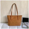 Brown embossed tote bag with heart patterns and slim handles in a warm setting - Brown No Pendant