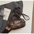 Chic brown Boston baguette bag in glossy faux leather with a stylish top handle - Basic Style / Brown