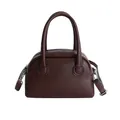 Dark brown pebbled leather baguette bag with top handles and silver-tone hardware - Brown