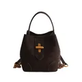 Minimalist dark brown suede bucket bag with gold cross buckle and chain strap detail - Brown