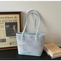 Light blue faux leather tote bag with grey textured fabric and vintage accents - Blue