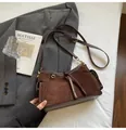 Dark brown faux suede baguette bag with adjustable shoulder strap and side pocket design - No Pendant / Brown