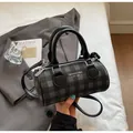Fashionable grey checkered bowling bag with crossbody strap and top handles - Black