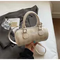 Fashionable beige checkered bowling bag with top handles and a crossbody strap - Off White
