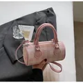Chic pink checkered bowling handbag with crossbody strap and gold metal hardware - Pink