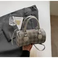 Grey checkered barrel bag with silver hardware and detachable crossbody strap - Silver