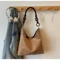 Retro tan faux suede tote bag featuring a vintage wooden bead shoulder strap detail - Regular Fit / Khaki