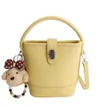Retro bright yellow leather bucket bag with top handle and cute plush dog pendant charm - Yellow (With Charm)