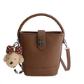 Brown litchi grain bucket bag with cute plush puppy charm and silver twist lock - Brown With Pendant