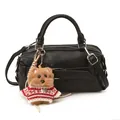 Detail of black faux leather bag with decorative strap and top dog plush charm - With Plush Charm / Black