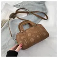 Brown embossed Boston handbag with floral patterns and adjustable shoulder strap - No Pendant / Brown