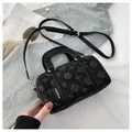 Chic black cylinder baguette bag with embossed patterns and adjustable shoulder strap - No Pendant / Black