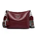 Large burgundy leather crossbody bag with ethnic embroidered strap and kangaroo logo - Burgundy