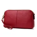 Dark red minimalist leather wristlet bag with pebbled texture and gold zipper - Burgundy