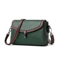 Green lychee pattern leather crossbody bag with brown trim and white stitching - Green