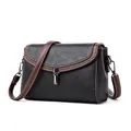 Chic black litchi grain leather crossbody bag with white contrast stitching and silver lock - Black