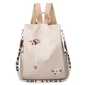 Mochila de tela Oxford beige para mujer con bordado floral y correas ajustables - Caqui