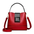 Red and black contrast bucket bag in lychee leather with gold hardware and strap - Red