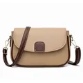 Minimalist two-tone crossbody saddle bag with pebbled leather and gold hardware - Khaki