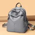 Modern grey nylon backpack for women featuring multiple zipper compartments and adjustable straps - Grey Large