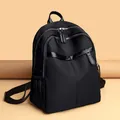 Women's black nylon backpack with multi-zipper compartments and adjustable straps - Black Large