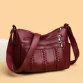 Versatile burgundy crossbody bag with multiple zippers and litchi grain texture detail - Burgundy