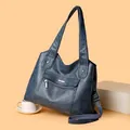 Fashionable navy blue multi-layer soft faux leather handbag with shoulder strap and metal logo - Lake Blue