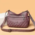 Mauve purple crossbody bag with multi-zipper layers and quilted pattern design - Lotus Pink