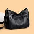 Classic black tote bag with multi-zipper compartments and textured leather finish - Black